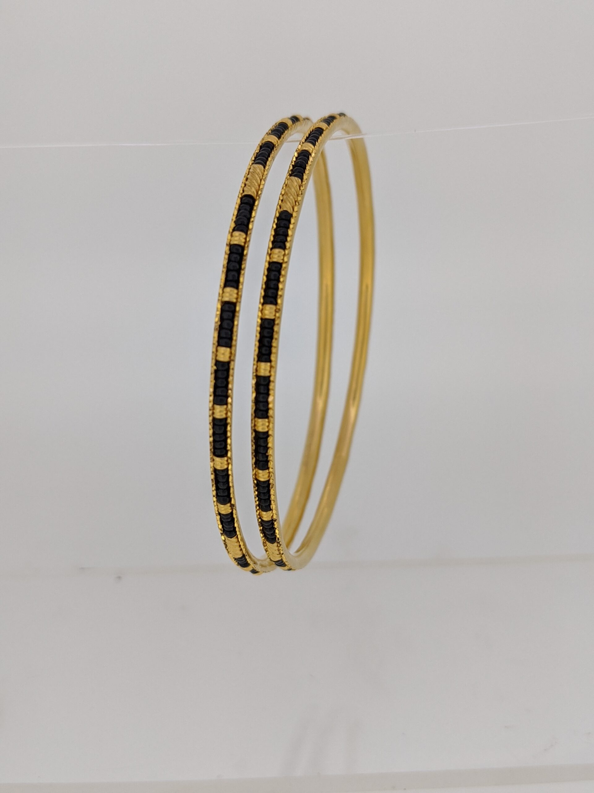Shoshaa Bangle Bracelets and Cuffs  Buy SHOSHAA GoldPlated Black and Pink  Beaded Circular Shaped Charm Bracelet Online  Nykaa Fashion